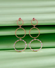 Synchronized Circlets Push Button Silver Earring